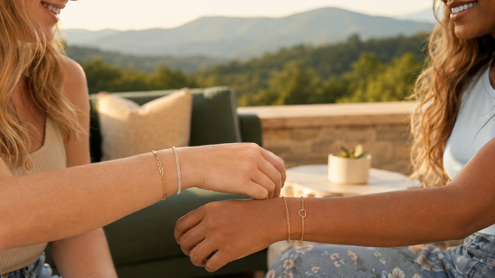 Two friends wearing gold and silver permanent bracelets together in the North Georgia mountains
