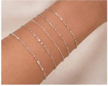 Sterling silver bracelets on a wrist
